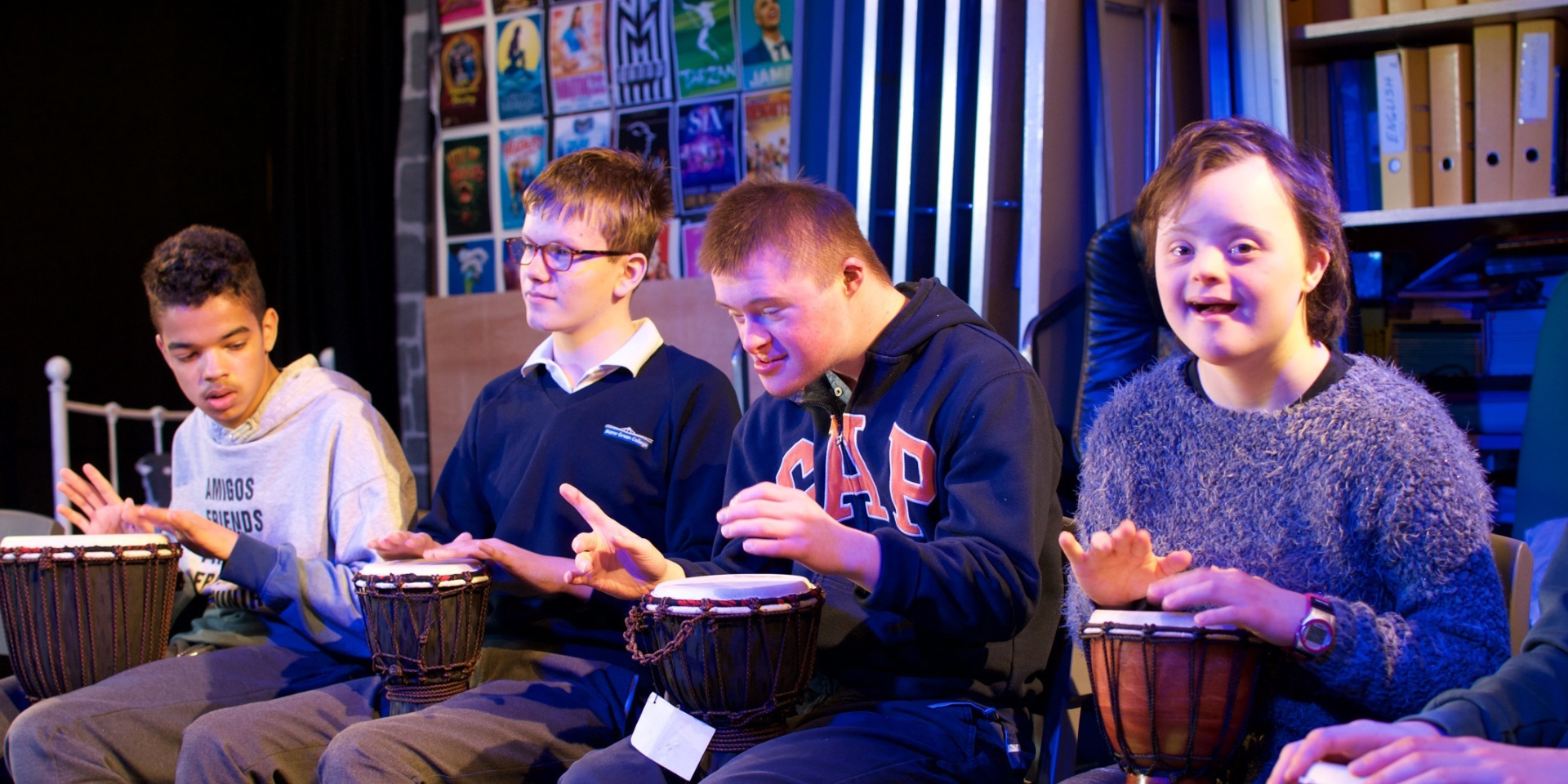 Students playing djembe drums